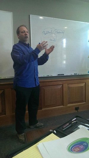 Shem speaking to DragonSearch employees about the need to never stop learning.