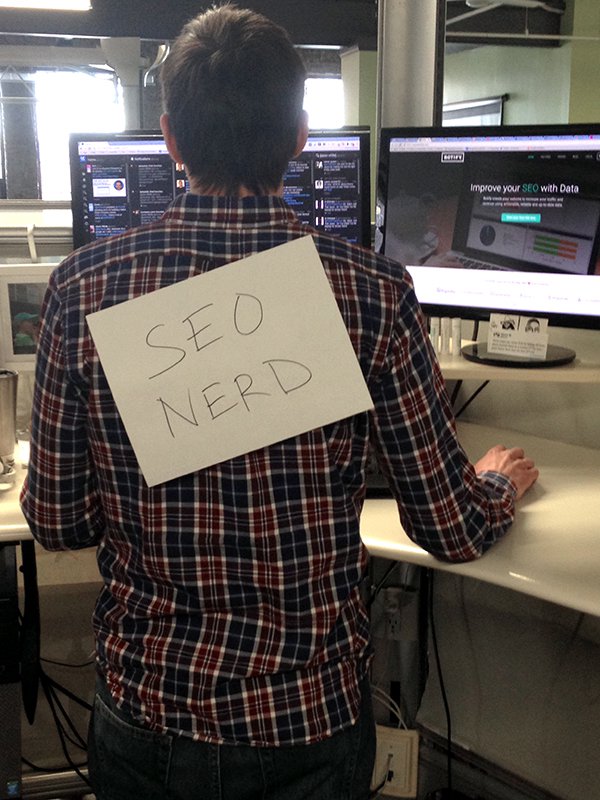 Jason wearing an SEO Nerd sign on his back while writing about social schema